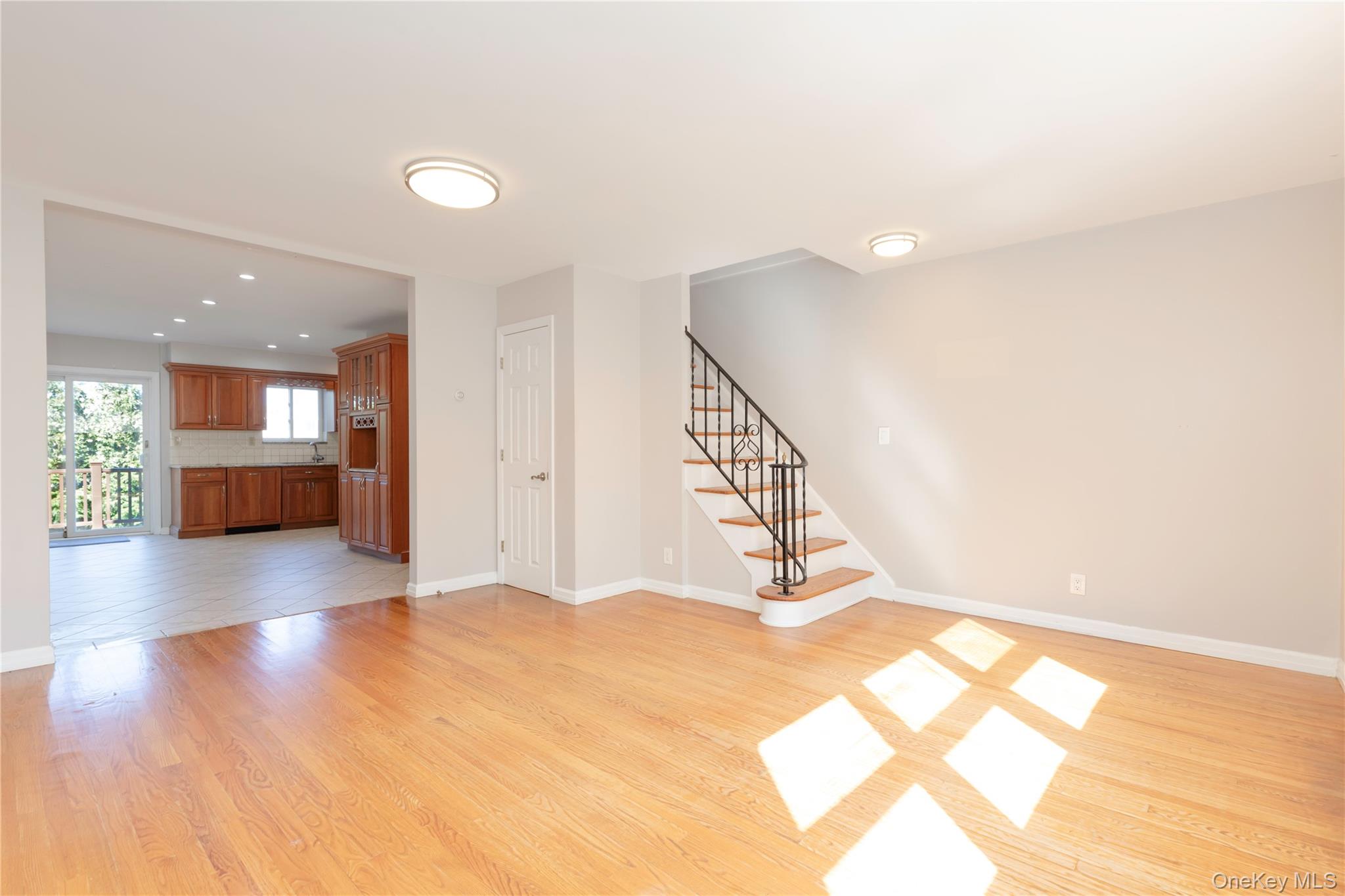 223 Ditmars Street Bronx, NY 10464 - Photo 14 of 28 a view of a livingroom with a staircase