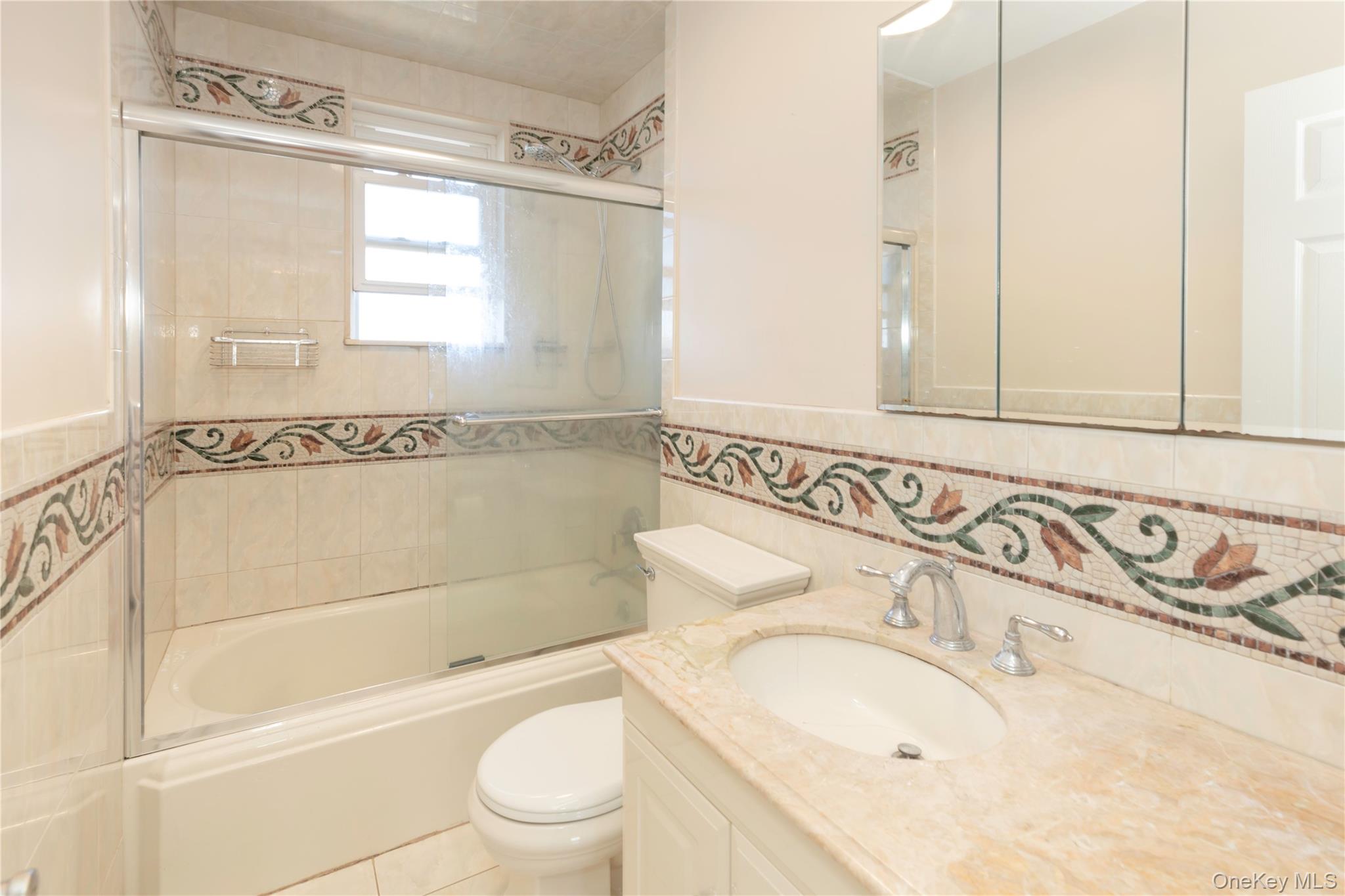223 Ditmars Street Bronx, NY 10464 - Photo 16 of 28 a bathroom with a sink a toilet and a bathtub