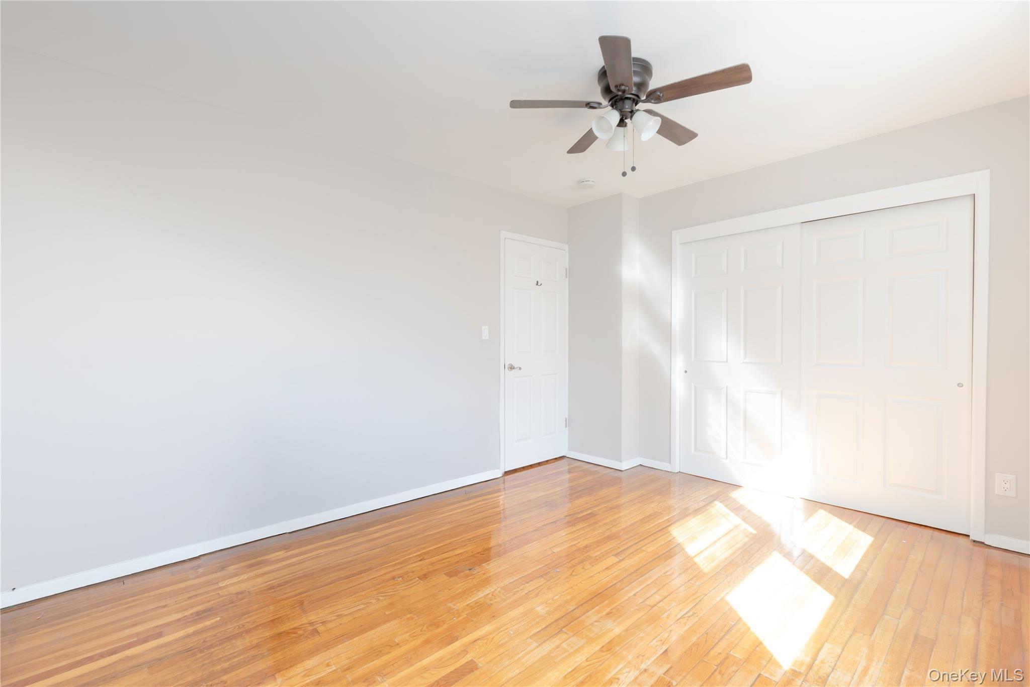 223 Ditmars Street Bronx, NY 10464 - Photo 17 of 28 a view of a room with a ceiling fan