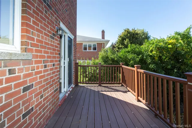 an aerial view of a house with a yard and balcony