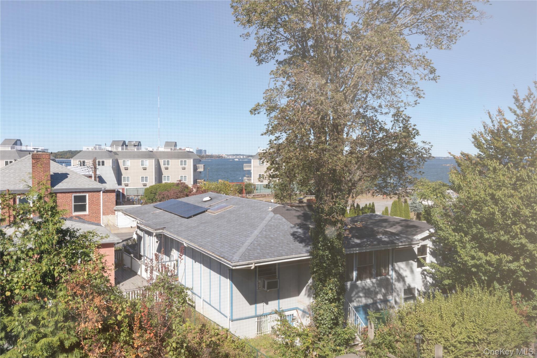 223 Ditmars Street Bronx, NY 10464 - Photo 24 of 28 an aerial view of a house with a yard and balcony