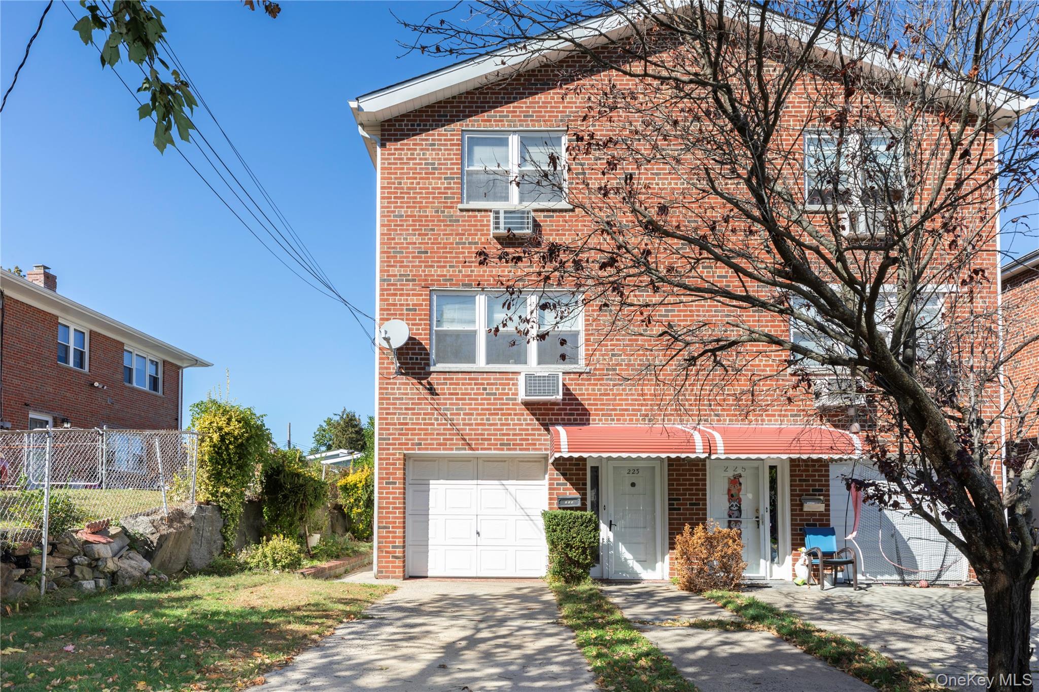 223 Ditmars Street Bronx, NY 10464 - Photo 27 of 28 a front view of a house with garden