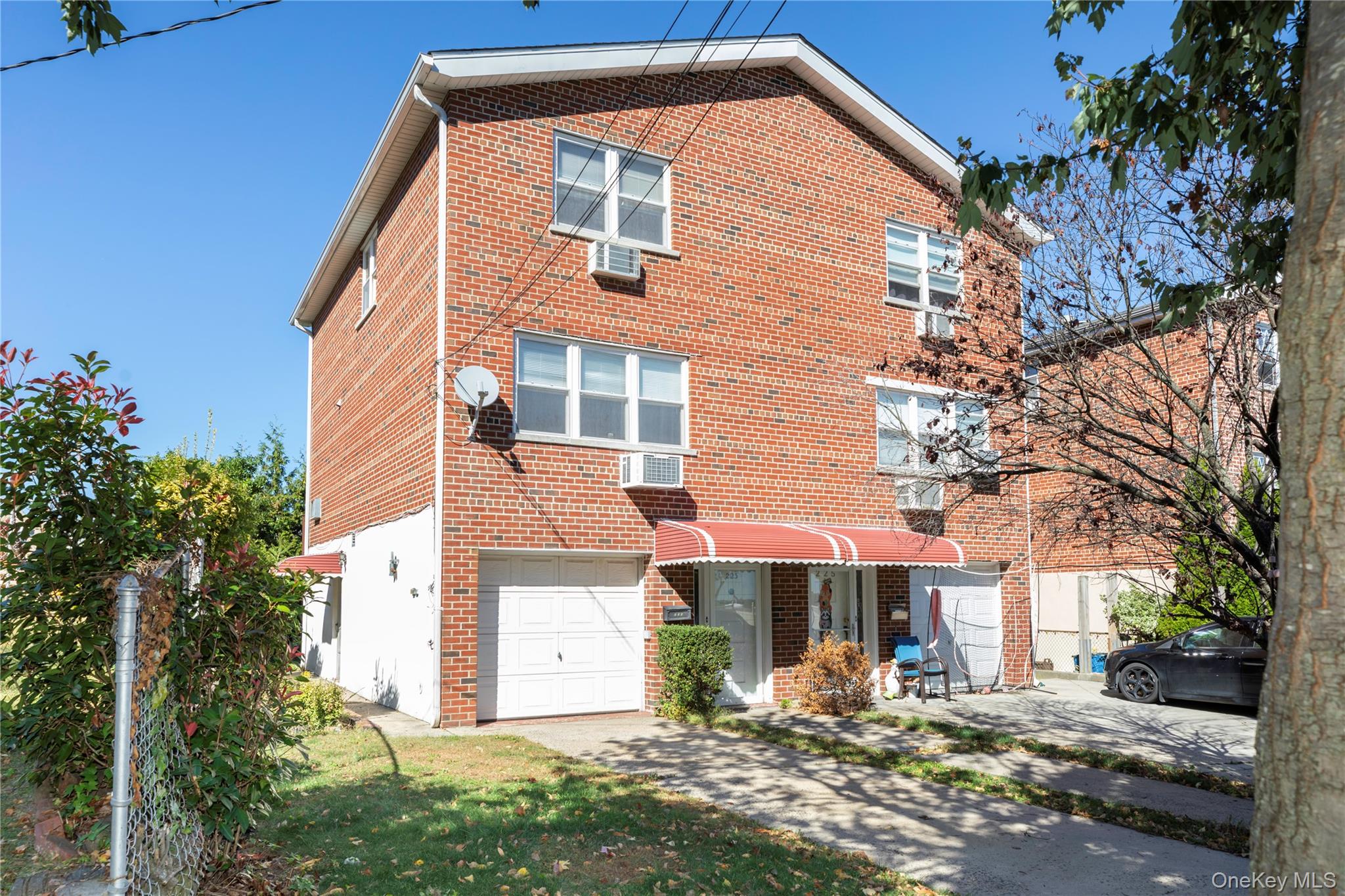 223 Ditmars Street Bronx, NY 10464 - Photo 28 of 28 a front view of a house with garden