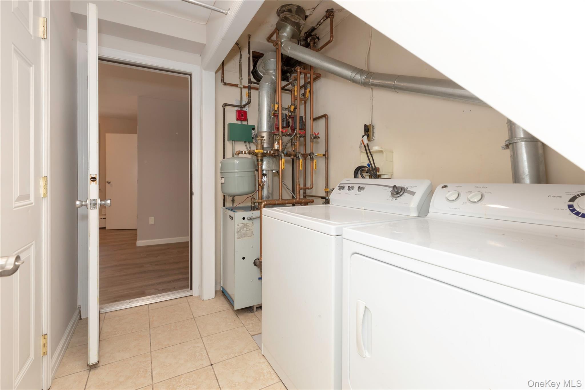 223 Ditmars Street Bronx, NY 10464 - Photo 6 of 28 a utility room with dryer and washer
