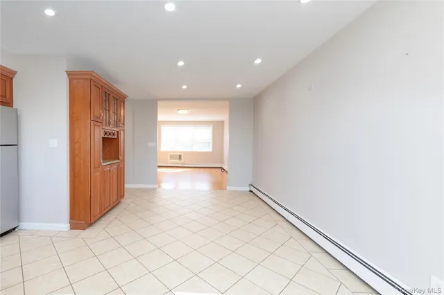 a kitchen with stainless steel appliances a refrigerator sink and cabinets