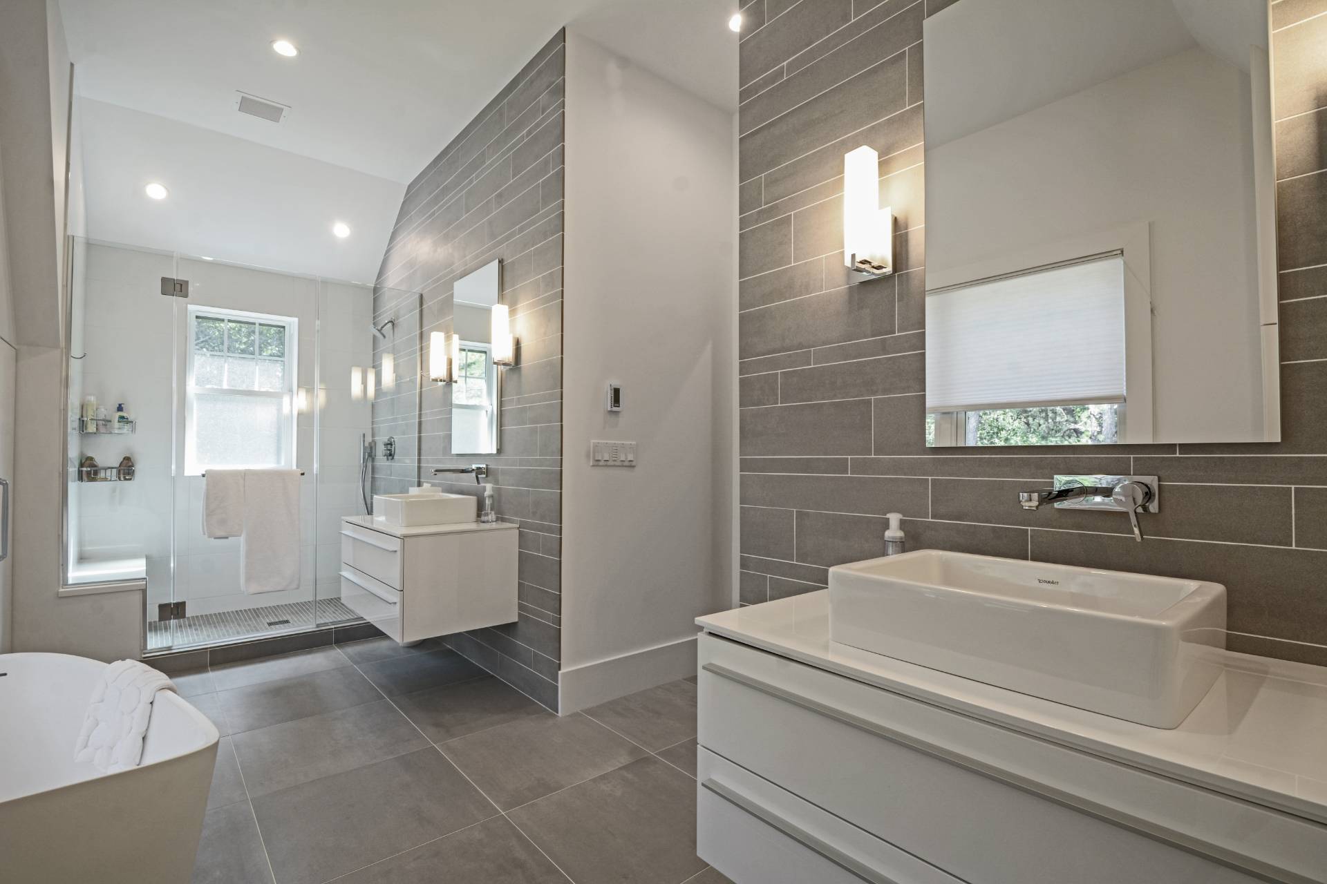 198 Bull Path East Hampton, NY 11937 - Photo 25 of 50 a bathroom with a sink a mirror and a bathtub