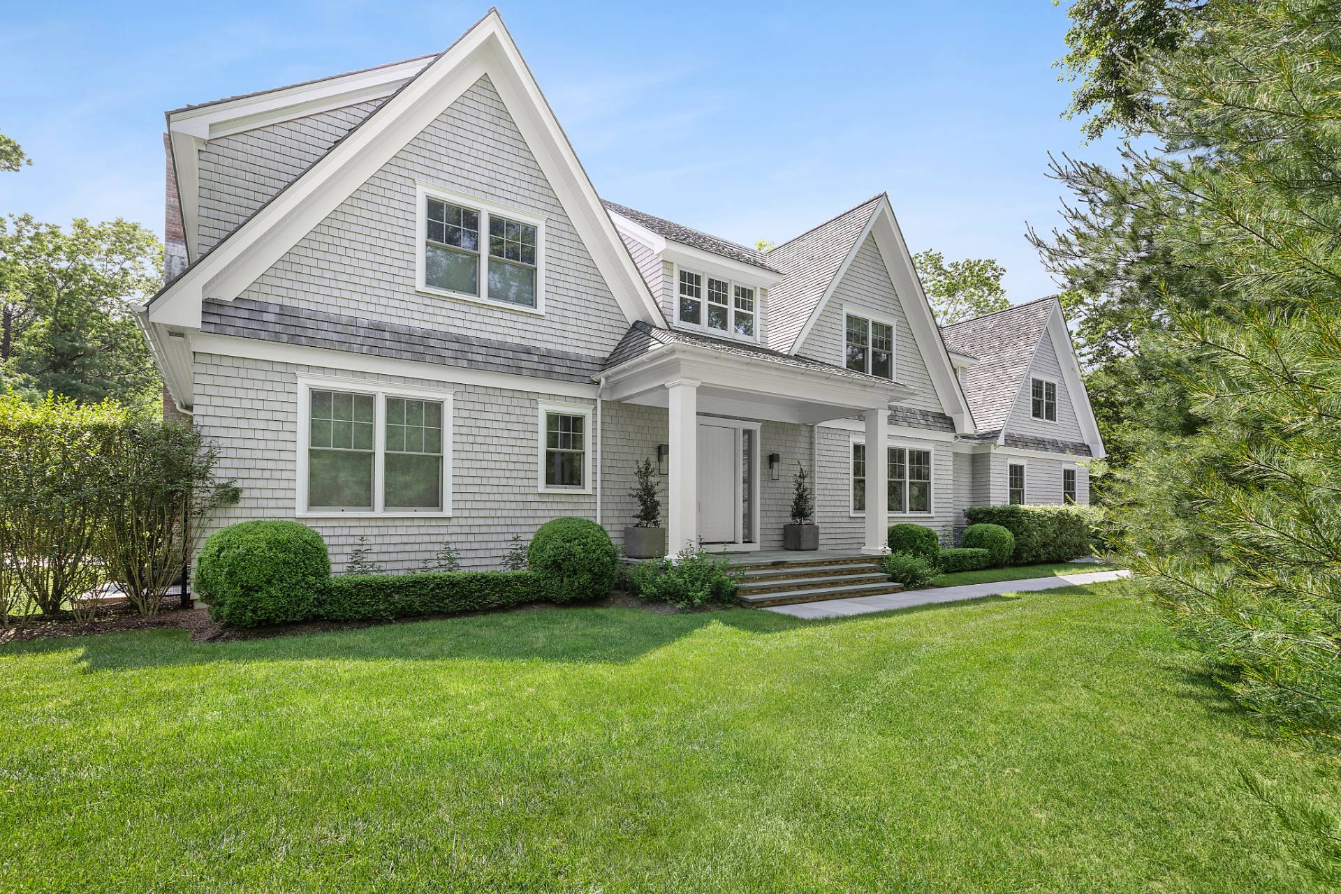 198 Bull Path East Hampton, NY 11937 - Photo 3 of 50 a front view of a house with a yard