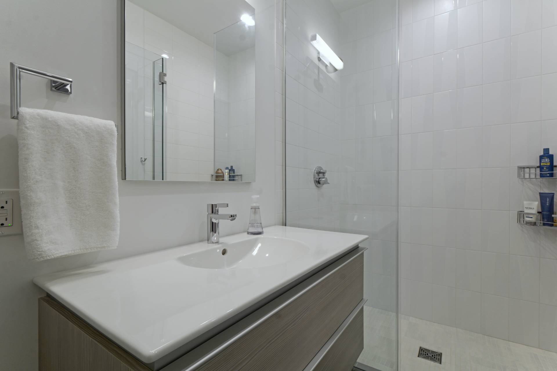 198 Bull Path East Hampton, NY 11937 - Photo 31 of 50 a bathroom with a sink a light fixture and a mirror