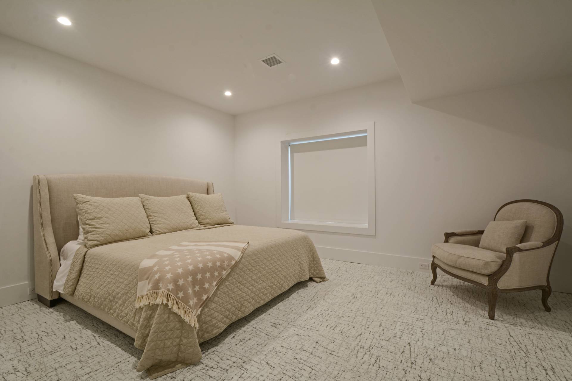 198 Bull Path East Hampton, NY 11937 - Photo 38 of 50 a bedroom with a bed and a chair