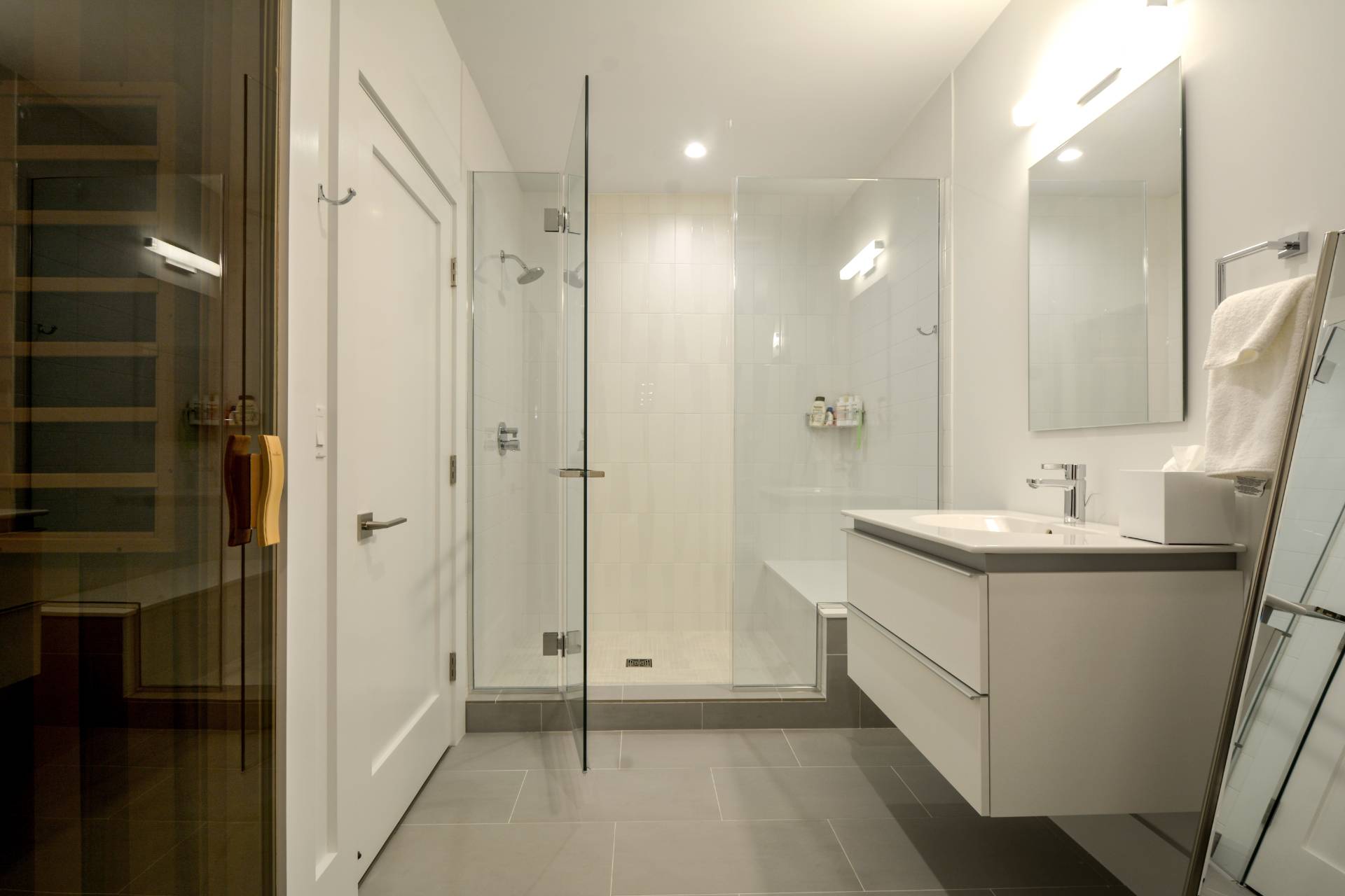 198 Bull Path East Hampton, NY 11937 - Photo 39 of 50 a bathroom with a shower sink and mirror