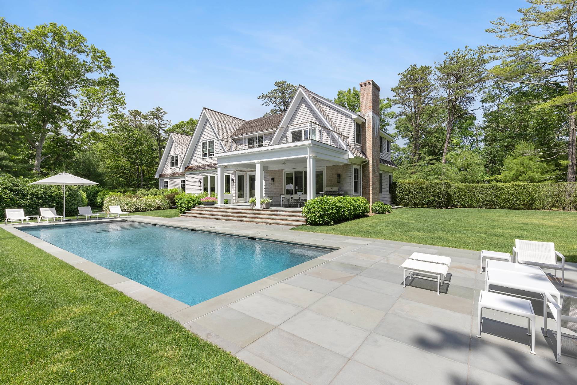 198 Bull Path East Hampton, NY 11937 - Photo 47 of 50 a view of a house with a swimming pool