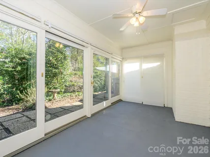 a view of an empty room with a window