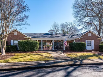 a view of a house with snow on the road
