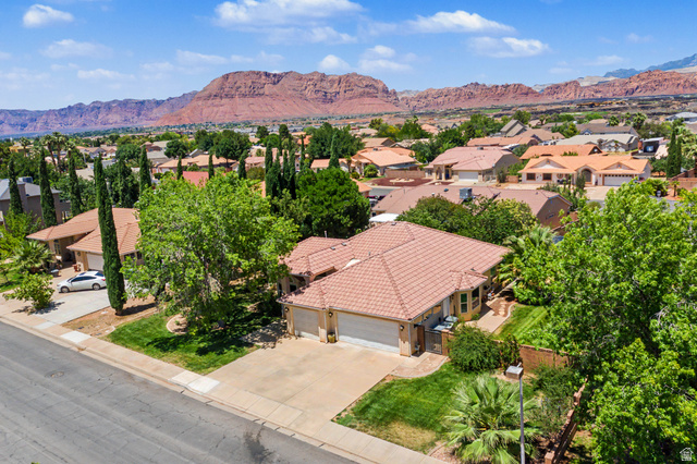 3034 Swiss Drive Santa Clara, UT 84765 - Photo 55 of 59 Suburban residence with a multi-car driveway, mature trees, and landscaping