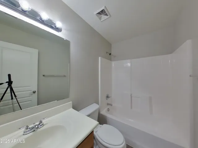 an empty room with wooden floor