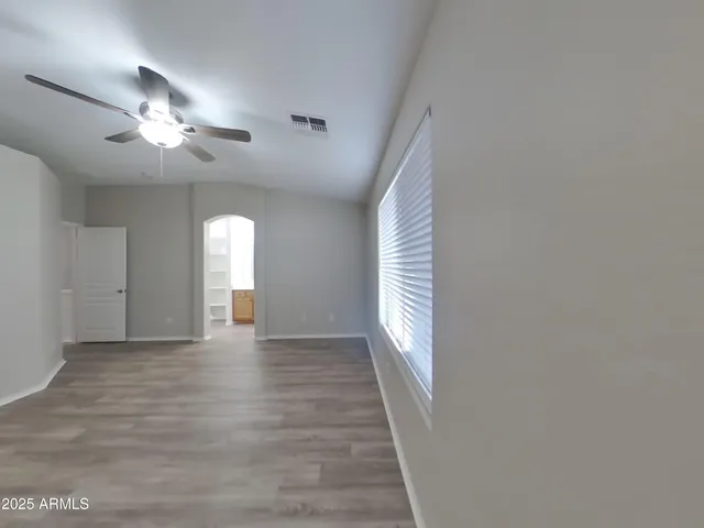 a large kitchen with stainless steel appliances lots of counter space and a sink