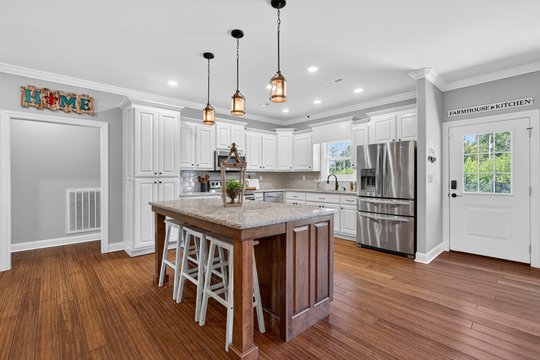86 L Mitchell Road Kelso, TN 37348 - Photo 9 of 49 a kitchen with stainless steel appliances granite countertop a refrigerator a sink dishwasher a stove and a wooden floor