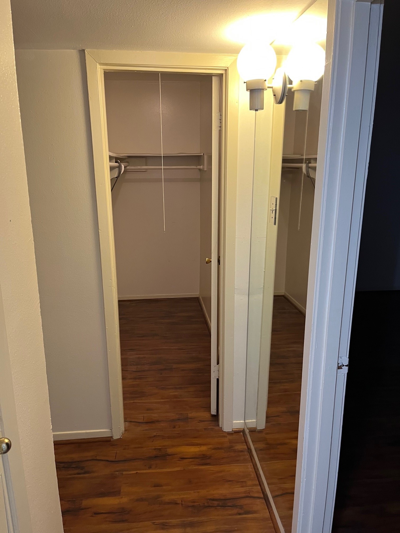 3938 West Alabama Street, Unit 12 Houston, TX 77027 - Photo 25 of 25 Dressing area with mirrored closet doors leading to spacious walk-in closet.