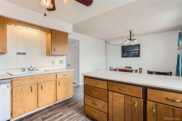 a kitchen with a sink cabinets and window
