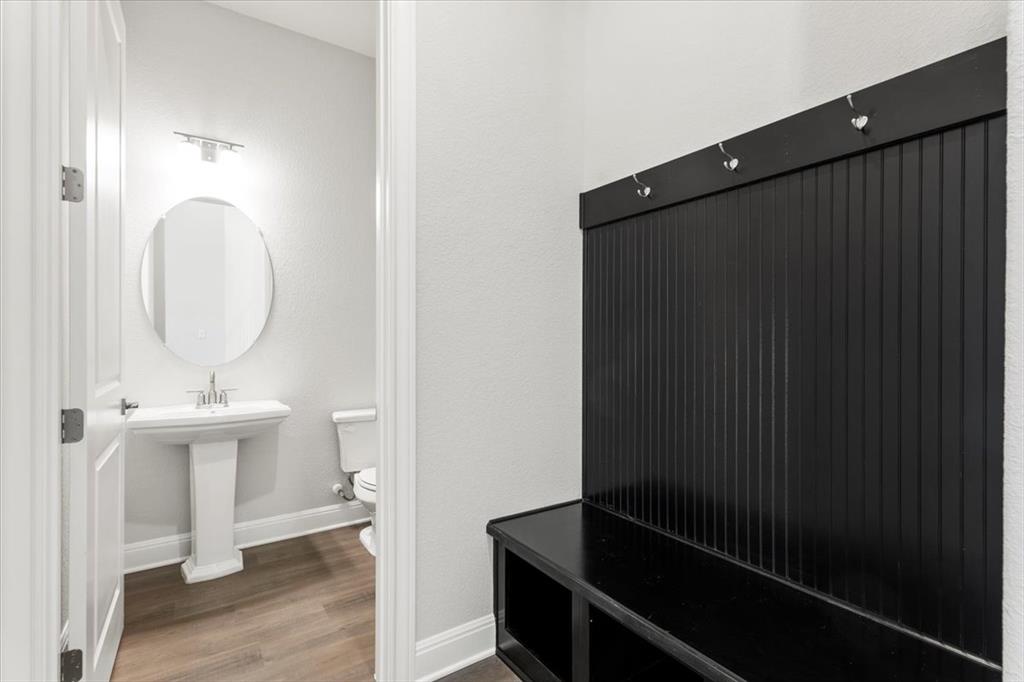 100 Plumfield Cove Georgetown, TX 78628 - Photo 14 of 40 a view of a hallway with wooden floor and staircase