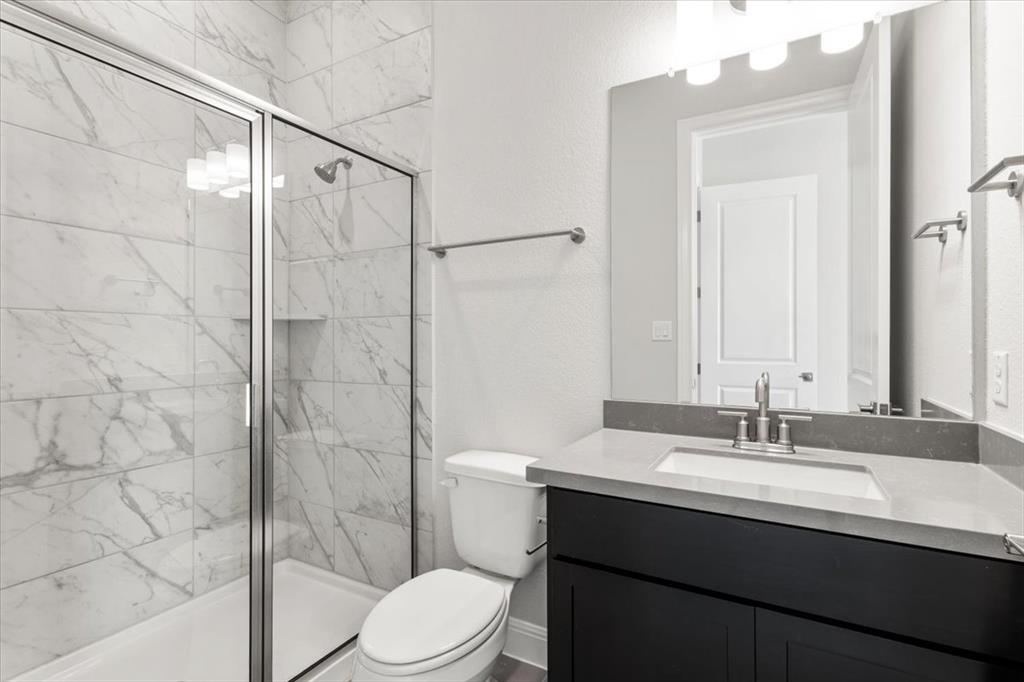 100 Plumfield Cove Georgetown, TX 78628 - Photo 26 of 40 a bathroom with a sink a toilet and shower