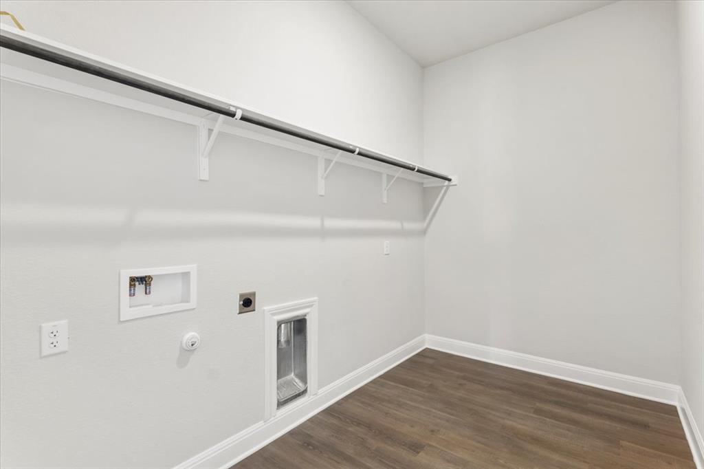 100 Plumfield Cove Georgetown, TX 78628 - Photo 29 of 40 a view of a hallway with wooden floor