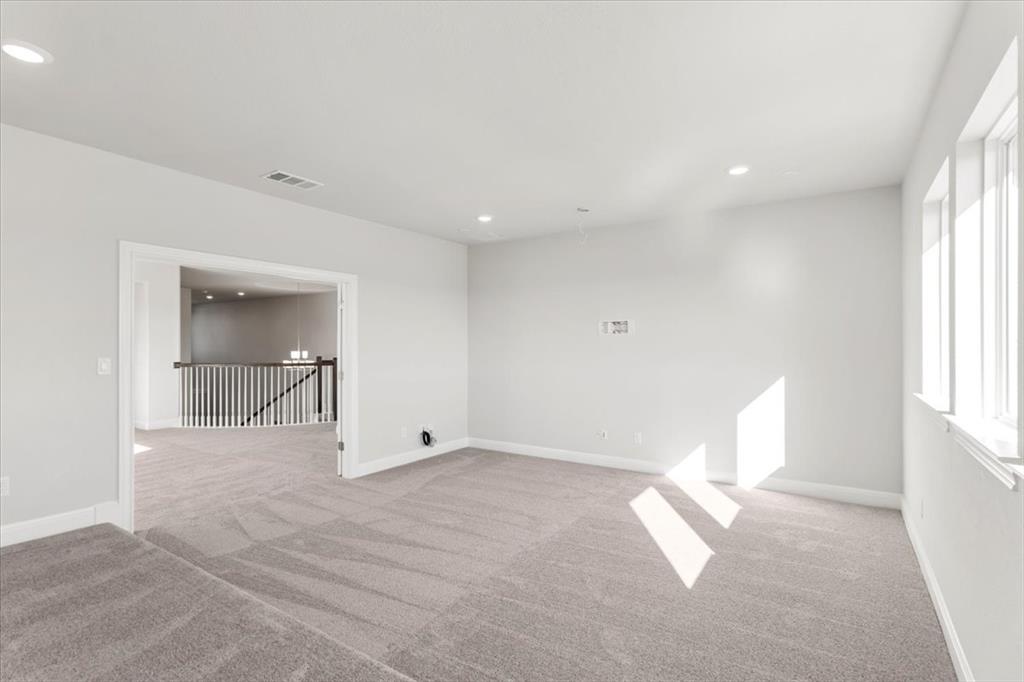 100 Plumfield Cove Georgetown, TX 78628 - Photo 39 of 40 wooden floor in an empty room with a window