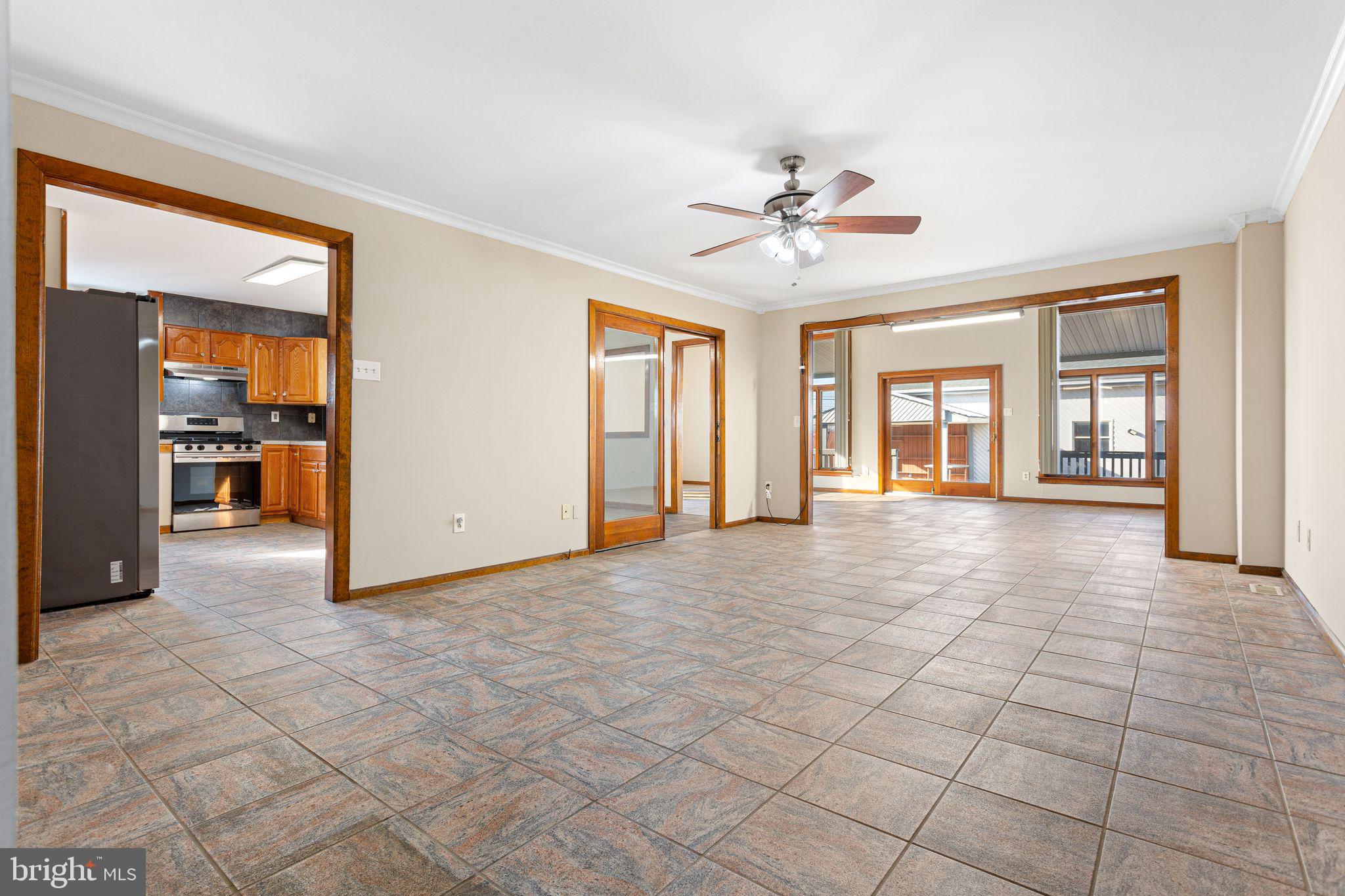 2623 Knights Road Bensalem, PA 19020 - Photo 7 of 50 a view of a livingroom with a chandelier fan and windows