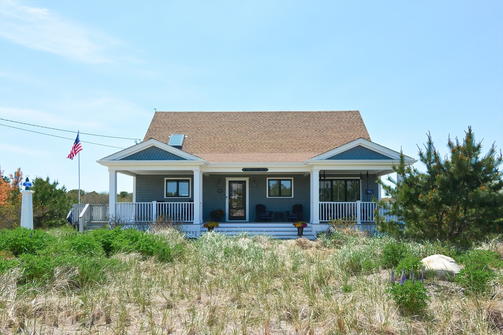 308 Phillips Road Sandwich, MA 02563 - Photo 1 of 42 a front view of a house with garden