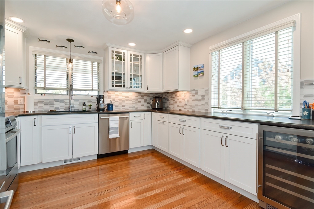 308 Phillips Road Sandwich, MA 02563 - Photo 11 of 42 a kitchen with granite countertop white cabinets sink and window