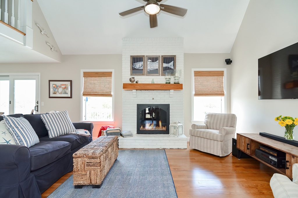 308 Phillips Road Sandwich, MA 02563 - Photo 14 of 42 a living room with furniture and a fireplace
