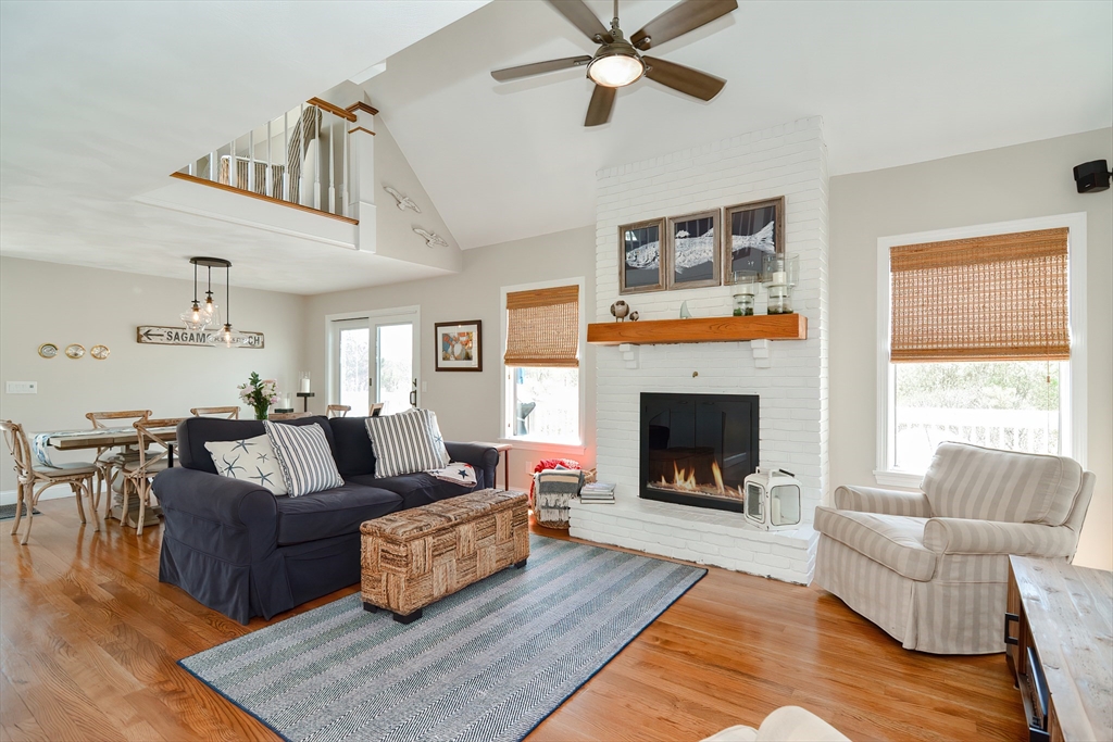 308 Phillips Road Sandwich, MA 02563 - Photo 15 of 42 a living room with furniture and a fireplace