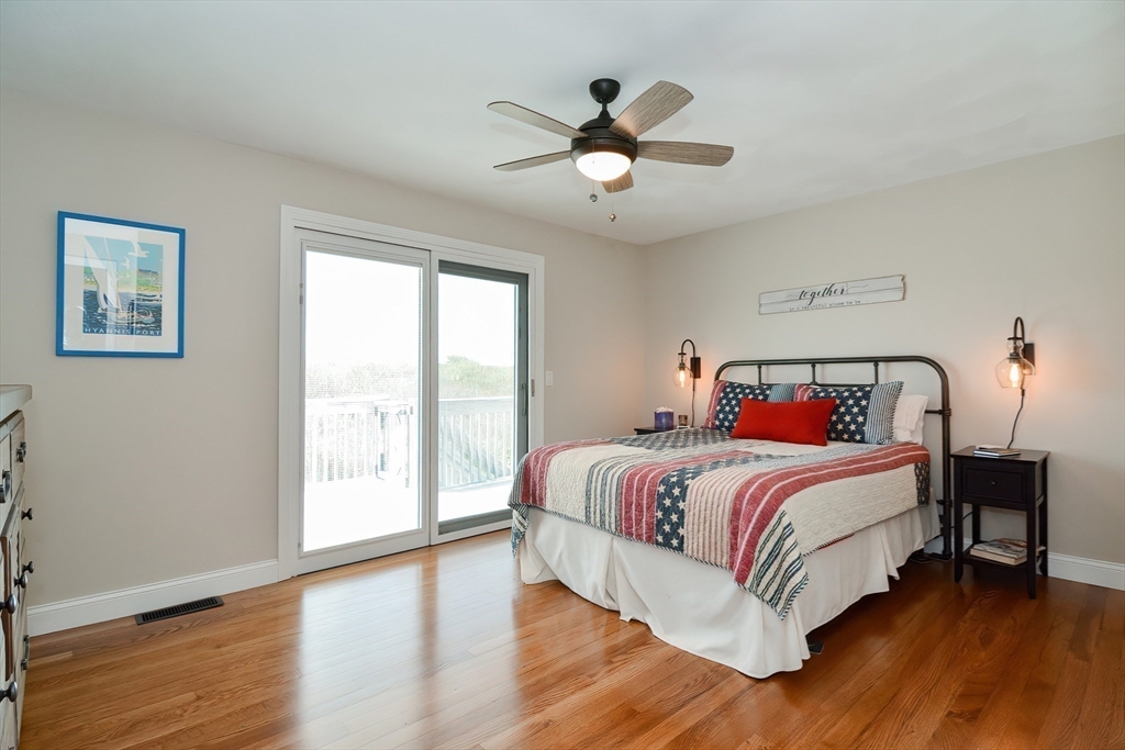 308 Phillips Road Sandwich, MA 02563 - Photo 18 of 42 a bedroom with a large bed and a window