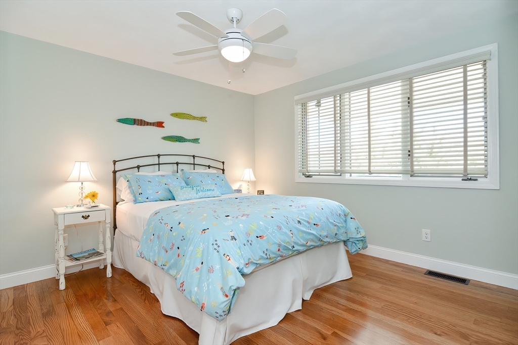 308 Phillips Road Sandwich, MA 02563 - Photo 19 of 42 a bedroom with a bed and a window