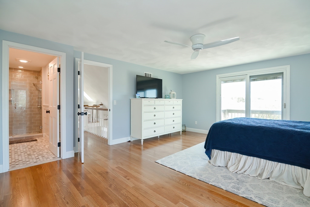 308 Phillips Road Sandwich, MA 02563 - Photo 23 of 42 a spacious bedroom with a bed and a dresser