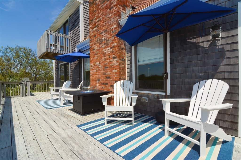 308 Phillips Road Sandwich, MA 02563 - Photo 31 of 42 a view of a chairs and table on the deck