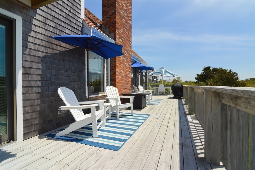 308 Phillips Road Sandwich, MA 02563 - Photo 32 of 42 a view of balcony with seating space and wooden floor