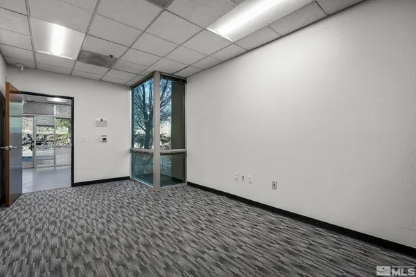 a view of a livingroom with wooden floor