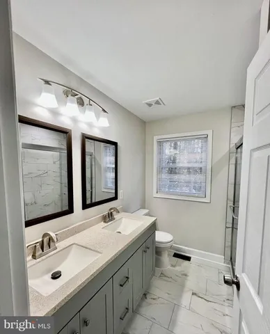 a bathroom with a shower and a toilet