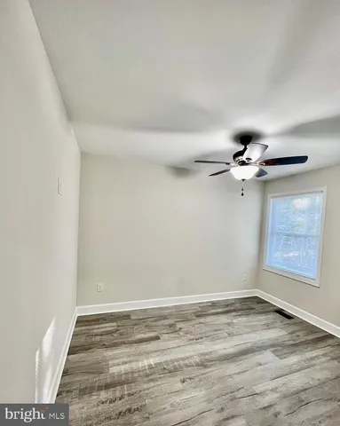a bathroom with a double vanity sink toilet mirror and shower