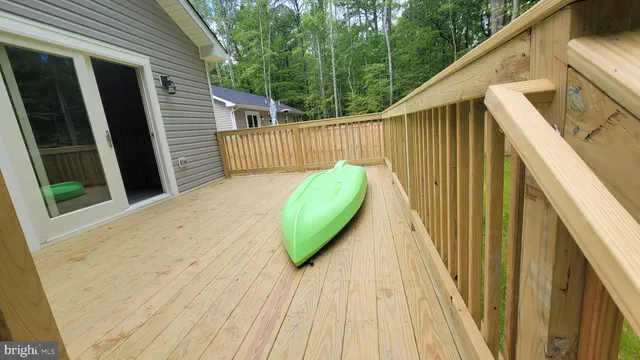a view of a balcony with wooden floor