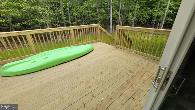 a view of balcony with wooden floor