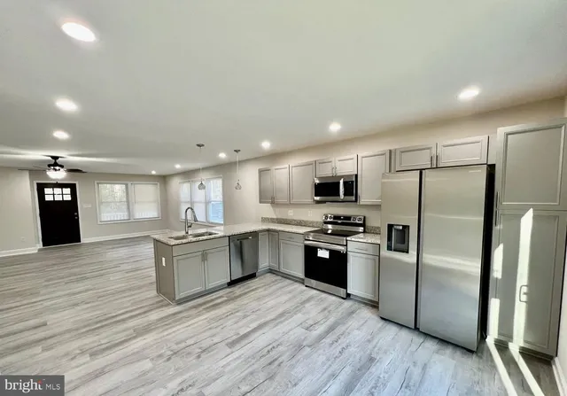 a view of kitchen and sink