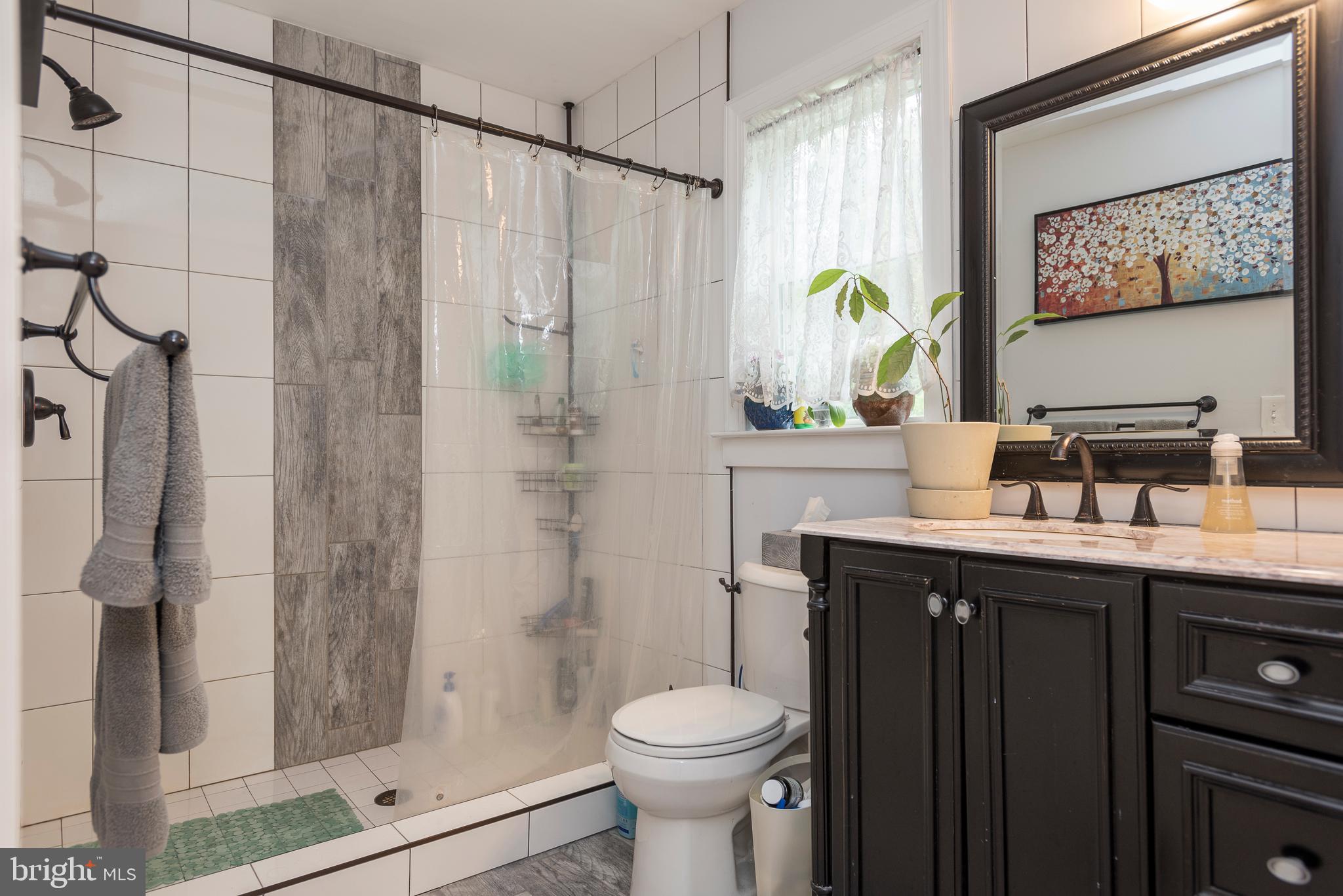9294 Rixeyville Road Culpeper, VA 22701 - Photo 21 of 31 master bath tiled floor and shower