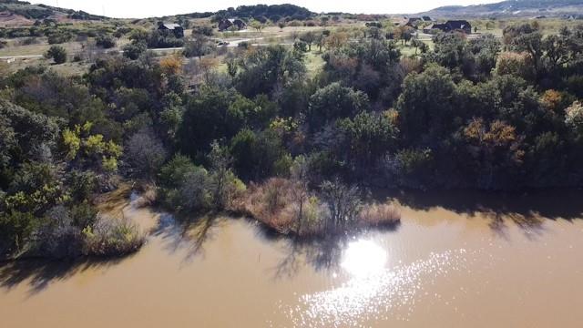 954 R Frog Branch Court Graford, TX 76449 - Photo 14 of 21 a view of a lake in middle of forest