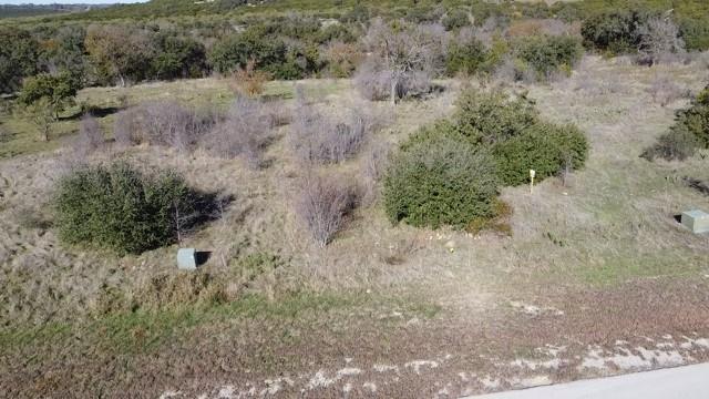 954 R Frog Branch Court Graford, TX 76449 - Photo 17 of 21 a view of a dry yard with lots of green space