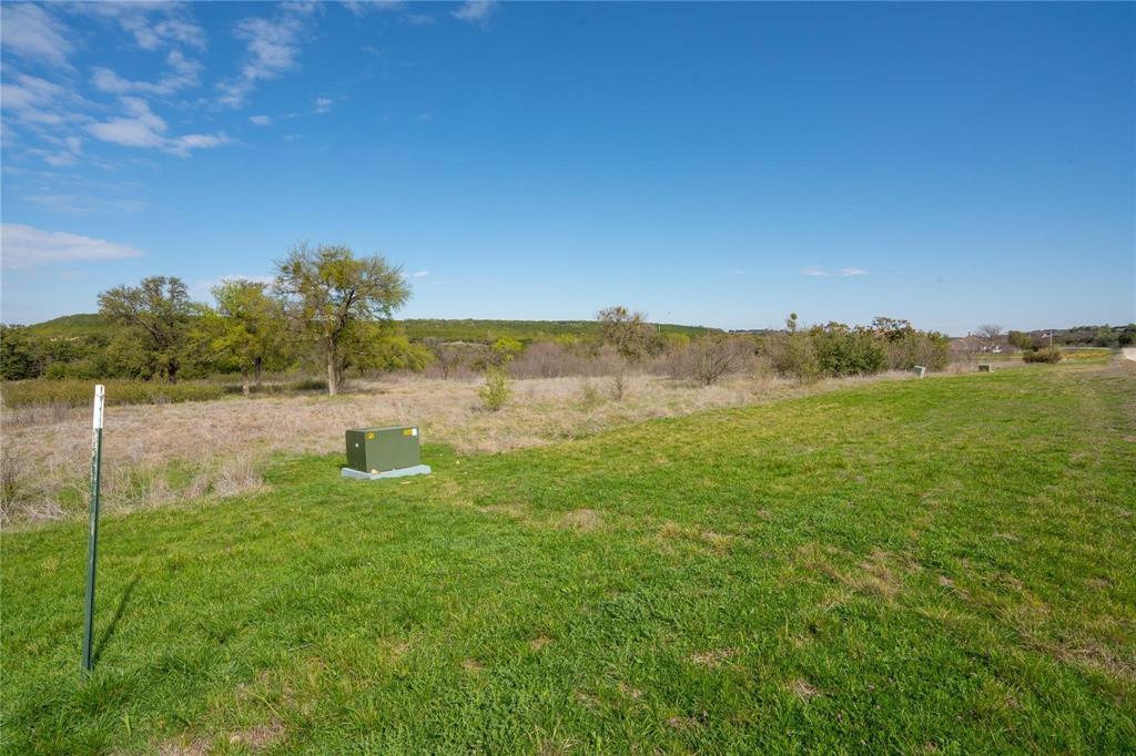 954 R Frog Branch Court Graford, TX 76449 - Photo 2 of 21 a view of a lake with houses in the background