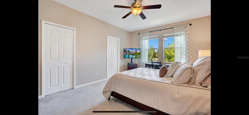 8174 Enchantment Drive, Unit 1601 Windermere, FL 34786 - Photo 11 of 21 a living room with furniture and a window