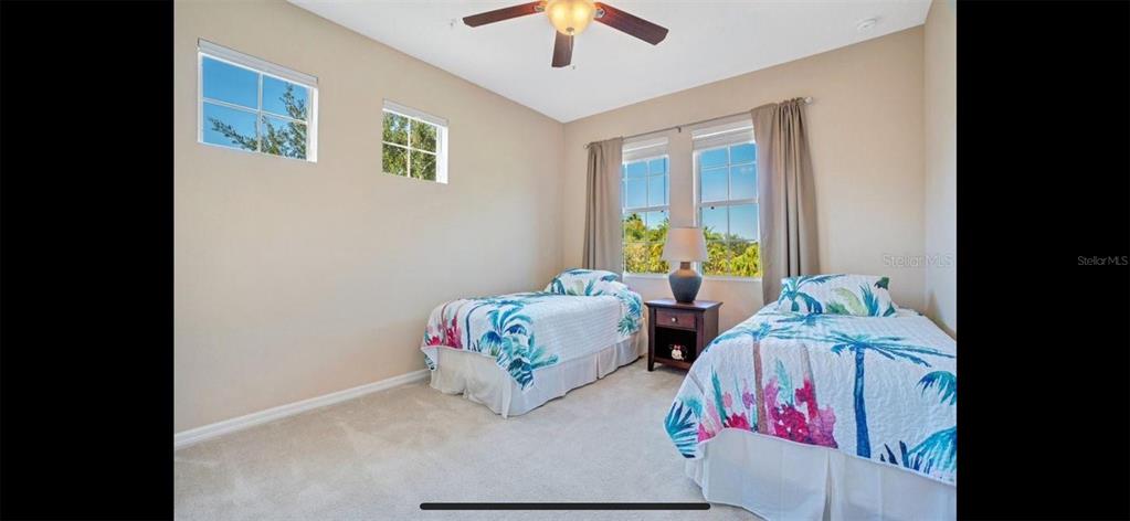 8174 Enchantment Drive, Unit 1601 Windermere, FL 34786 - Photo 14 of 21 a bedroom with furniture and a window