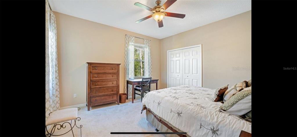 8174 Enchantment Drive, Unit 1601 Windermere, FL 34786 - Photo 15 of 21 a bedroom with a bed and a dresser